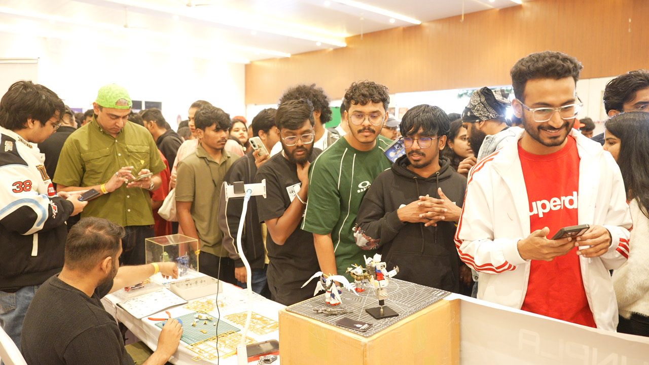 Fans browsing official merchandise at a booth